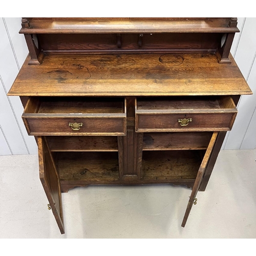 42 - A brass handled, oak dresser with carved detailed doors and bevelled-edged mirror.
Dimensions(cm): H... 