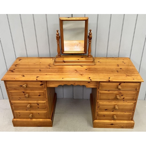 66 - A solid pine, eight-drawered, dressing table, together with a table-top pine mirror. Dimensions(cm) ... 