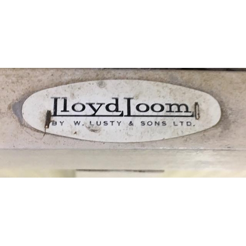 73B - A vintage Lloyd Loom ottoman, together with another. Dimensions(cm) H38/46, W92/96, D45/40.