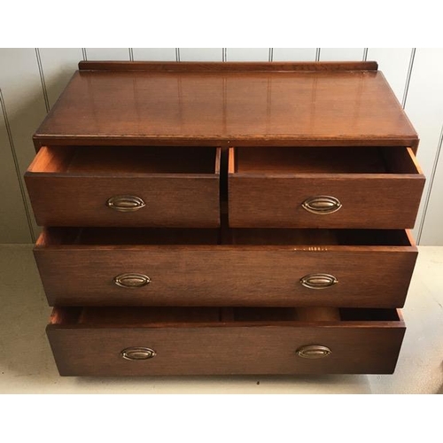 85 - An Edwardian, oak chest of two over two drawers, with brass handles. Dimensions(cm) H75, W98, D48.