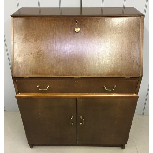 107 - A vintage 1950's bureau. Fall front desk area, with single drawer & double-door cupboard. Dimensions... 