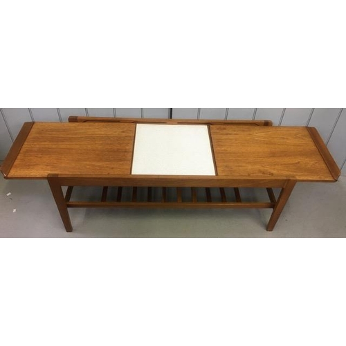 127A - A mid-century teak, extending coffee table, by Remploy. Dimensions(cm) H40, W110/150, D44.