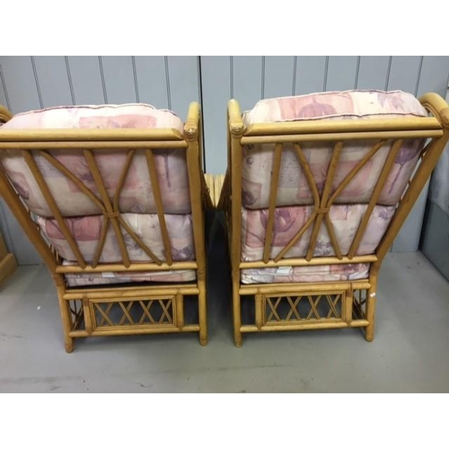 140 - A pair of matching bamboo & cane conservatory chairs. Dimensions(cm) H100(40 to seat), W72, D90.