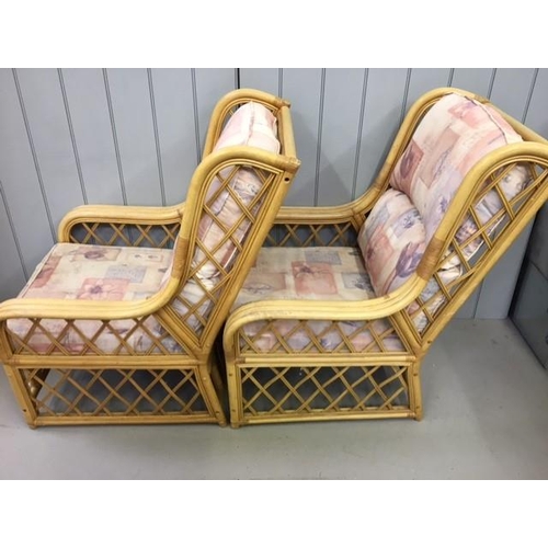 140 - A pair of matching bamboo & cane conservatory chairs. Dimensions(cm) H100(40 to seat), W72, D90.