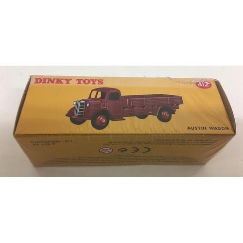 2042 - Atlas Editions Dinky 412 Austin Wagon, in yellow. Still Cellophane Sealed.