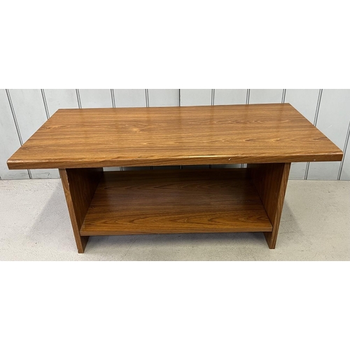 24 - A teak veneered coffee table. Dimensions(cm) H40, W96, D45.