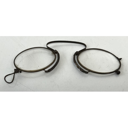 649 - An antique pair of spectacles.