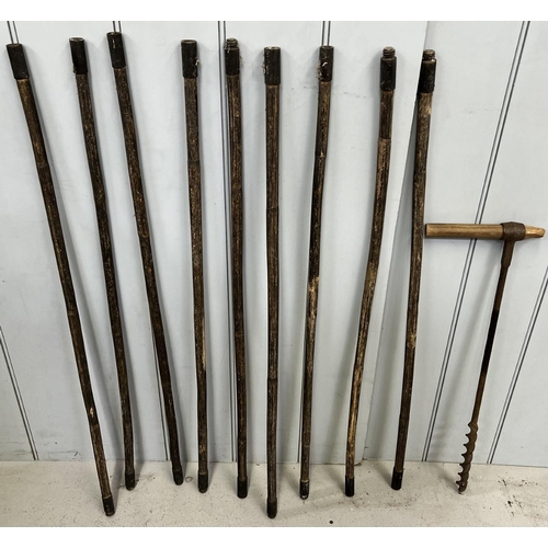 688 - A quantity of chimney-sweep rods (no brush), together with a wood auger drill.