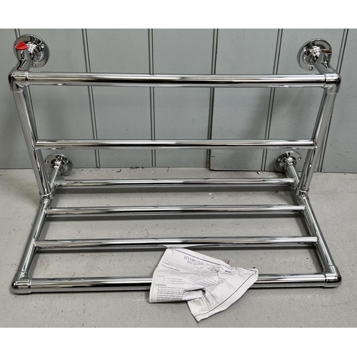 692 - A new/unused/boxed heated towel radiator. Dimensions(cm) H35, W67, D38.