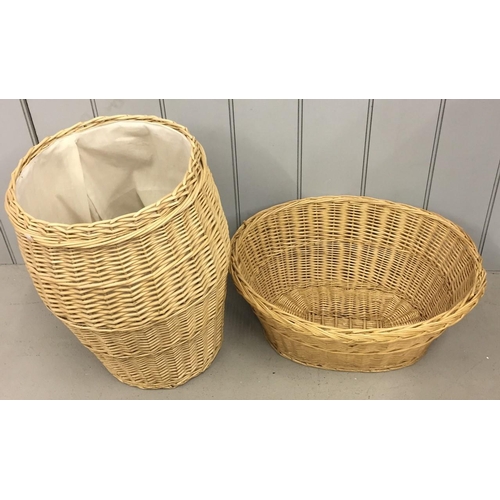 697 - A wicker laundry basket, together with another.