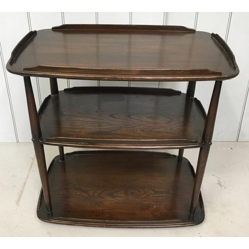 21B - An Ercol, dark elm three-tier trolley (without castors).
Dimensions(cm) H69, W72, D47.