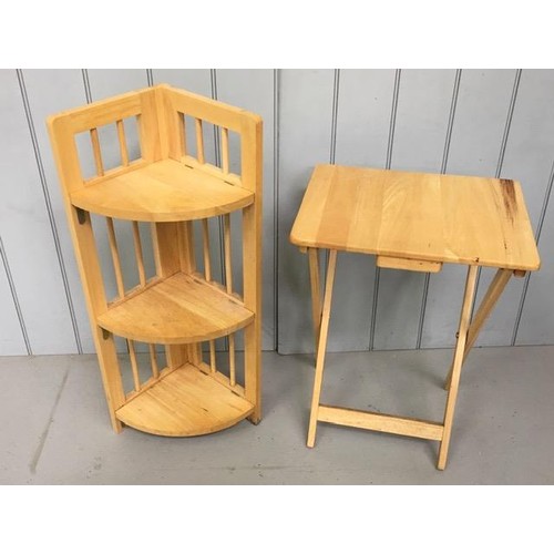 27 - A set of folding beech corner shelves, together with a folding beech table. Dimensions(cm) H98/74, W... 