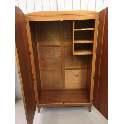 64 - A mid-century gentleman's double wardrobe. Two hanging rails & three internal shelved compartments. ... 