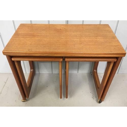 125 - A mid-century McIntosh Triform teak nest of tables, on castors.
Dimensions(cm) Largest H80, W74, D40... 