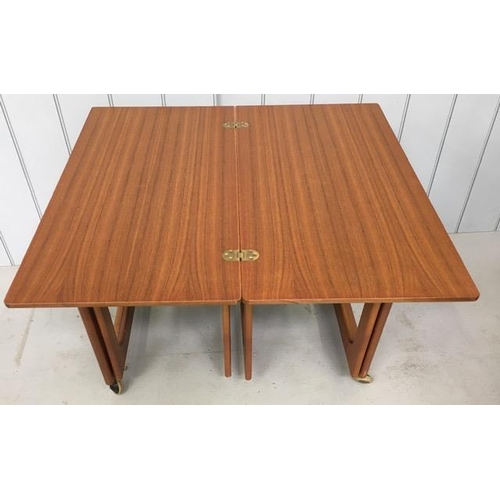 125 - A mid-century McIntosh Triform teak nest of tables, on castors.
Dimensions(cm) Largest H80, W74, D40... 