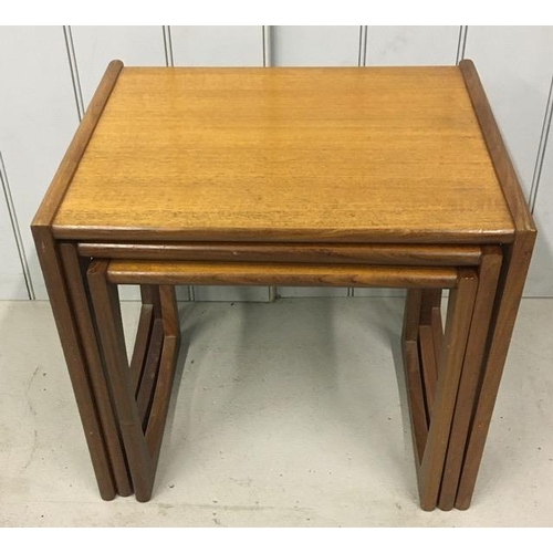 129 - A mid-century Astro-style, teak nest of tables. Largest dimensions(cm) H48, W54, D43.