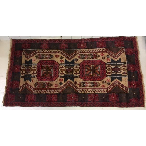 194 - An oriental, patterned rug. 190cm x 104cm.