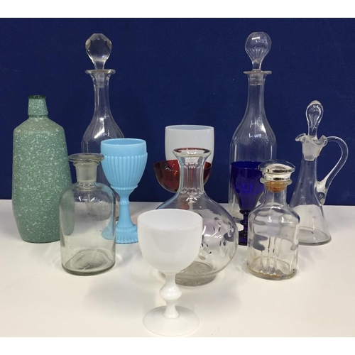 206C - A mixed lot of twelve vintage decanters, bottles & glasses.