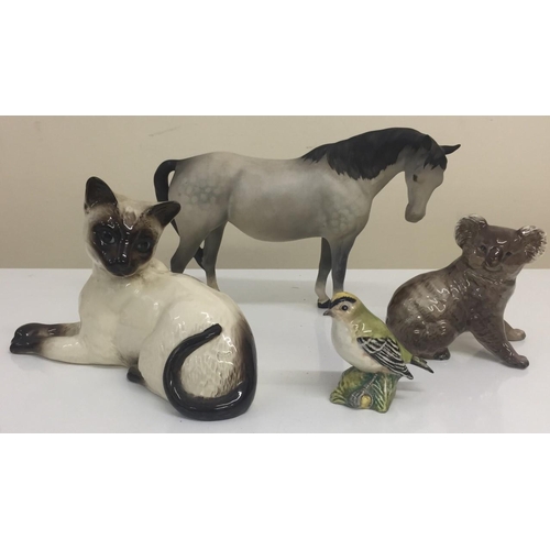 609 - A mixed lot of three Beswick figures (Grey Horse; Koala Bear; Goldcrest Bird) & a Royal Doulton Cat.