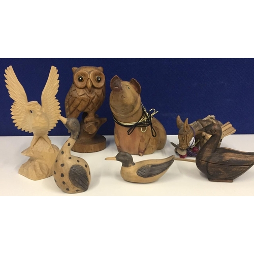 661E - A collection of seven wooden figures.