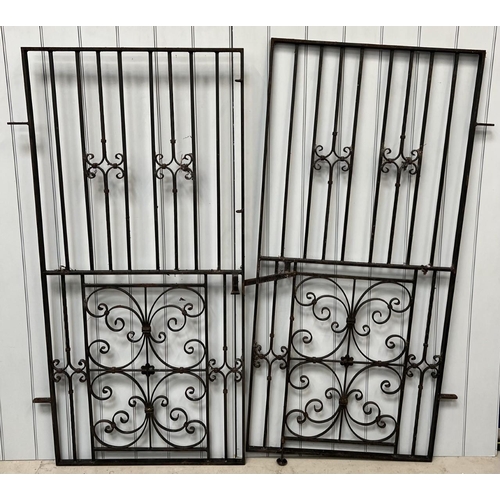 690 - A pair of wrought iron gates. Height 184cm & width 86.5cm.