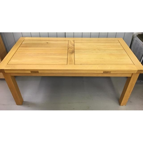 13 - A large, contemporary, light oak extendable dining table. Two extension leaves extend table from a 6... 