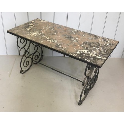 20 - A marble-topped coffee table, supported by wrought iron, scrolled legs. Dimensions(cm) H53, W93, D47... 