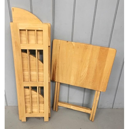 27 - A set of folding beech corner shelves, together with a folding beech table. Dimensions(cm) H98/74, W... 