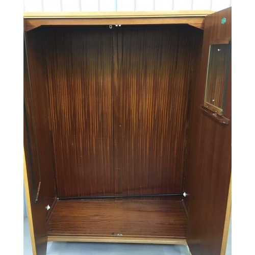 64B - A 'Lebus-Link' mid-century double wardrobe. Single hanging rail, shoe rail & two door mirrors. Dimen... 