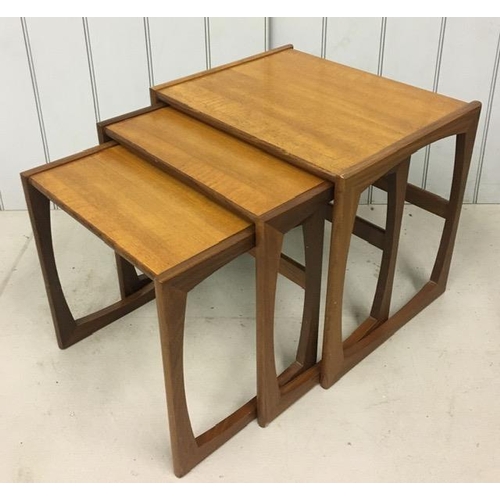 129 - A mid-century Astro-style, teak nest of tables. Largest dimensions(cm) H48, W54, D43.