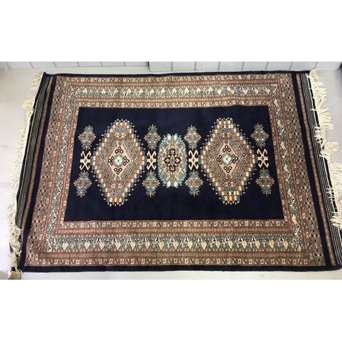 193 - An oriental, fringed rug. 180cm x 125cm.