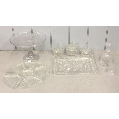 208 - A mixed lot of vintage glassware. Includes a cut glass dressing table set, sectioned hors d'oeuvres ... 