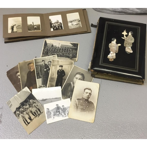 265 - An antique, oriental photo album adorned with mother of pearl figurines (spine needs attention), tog... 