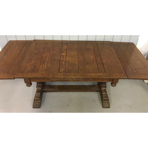 3 - An Edwardian, extending, oak drawer-leaf table. Dimensions(cm) H74, W132/212, D92.