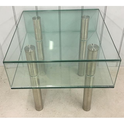 11 - A contemporary, designer chrome/glass coffee table. Dimensions(cm) H51, W50, D50.