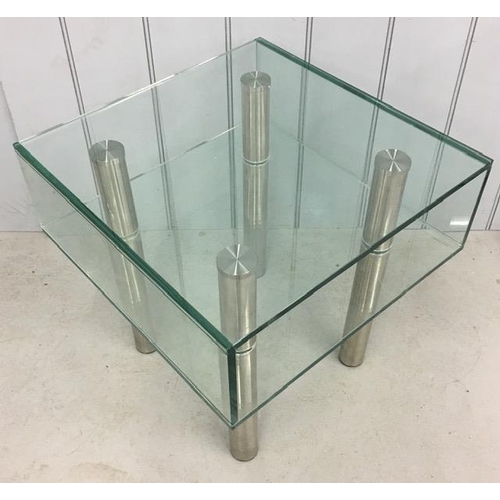 11 - A contemporary, designer chrome/glass coffee table. Dimensions(cm) H51, W50, D50.