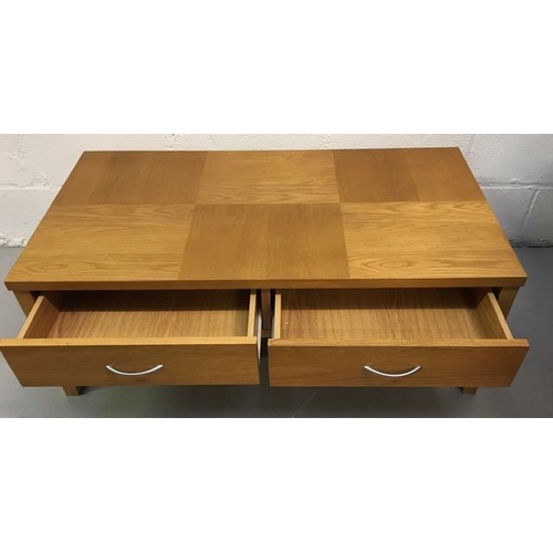 21A - A contemporary, beech-veneered coffee table, with two drawers. Dimensions(cm) H40, W107, D57.