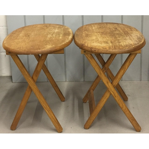 24 - A pair of oak, folding tables. Dimensions(cm) H54, W60, D40.