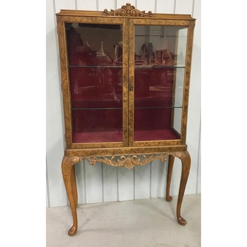 36 - A Queen Anne style, burr walnut/glazed, display cabinet. Two internal glass shelves. Key present.  D... 