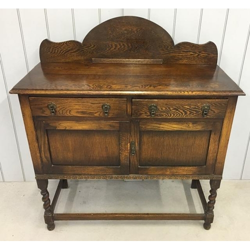 47 - An Edwardian buffet sideboard. Two drawers over double cupboard. Dimensions(cm) H119, W106, D45.