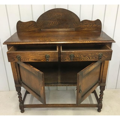 47 - An Edwardian buffet sideboard. Two drawers over double cupboard. Dimensions(cm) H119, W106, D45.