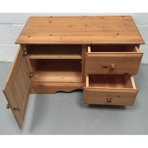 124 - A pine TV stand. Dimensions(cm) H57, W92, D44.