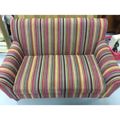 136 - A contemporary two-seater sofa, upholstered in multi-coloured, striped fabric, together with complim... 