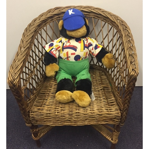 139 - A bamboo & cane tub chair & Kevin The Chimp soft toy.