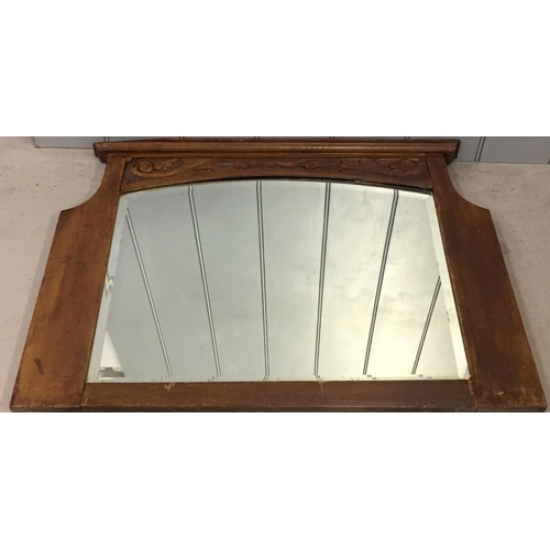 179 - Two vintage mirrors. An overmantle, oak framed, bevelled edged mirror (57cm x 81cm), together with a... 