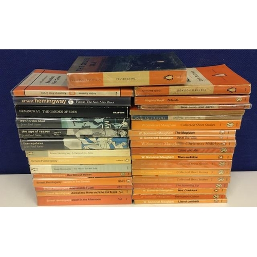 232 - A selection of approximately 33, vintage Penguin-published books. Includes series by Ernest Hemingwa... 