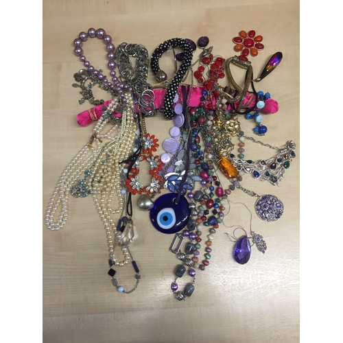 413 - A collection of approximately 30 costume necklaces.