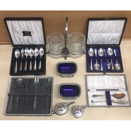 429 - A selection of silver-plated items. Includes two 2 sets of boxed teaspoons etc.