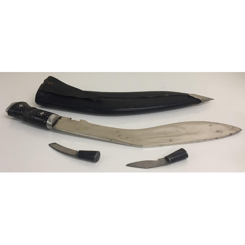 270 - A large Gurka Kukri, together with two smaller knives.