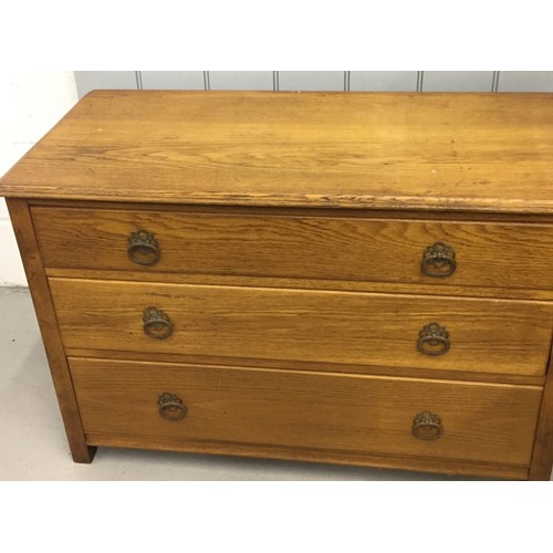 79 - A vintage oak chest of three drawers. Dimensions(cm) H66, W99, D45.